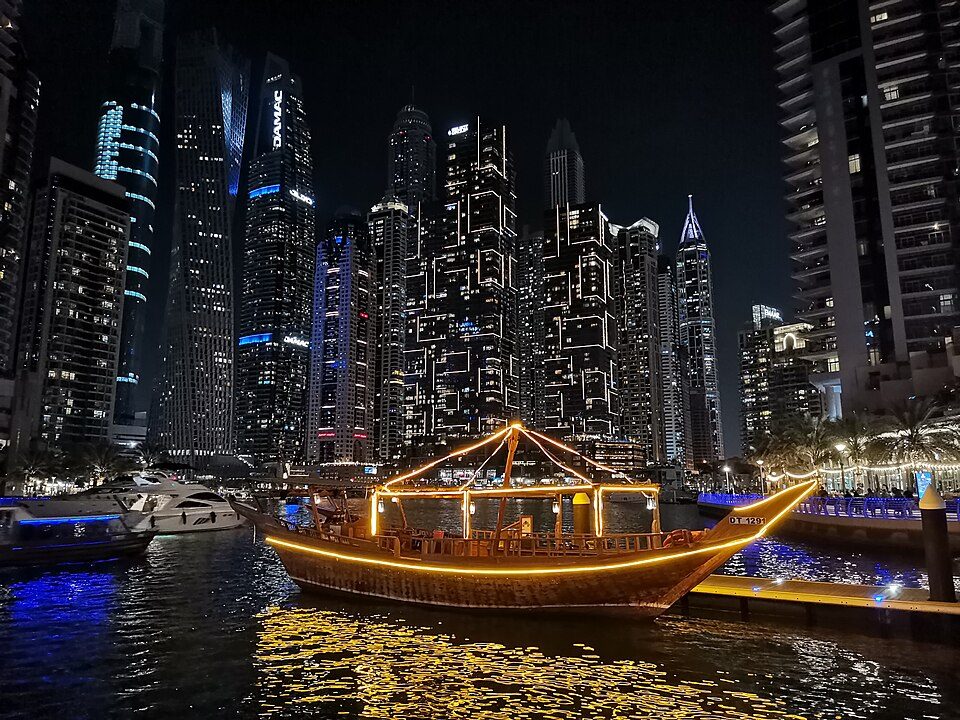 Traditional dhow illuminated in Dubai Marina